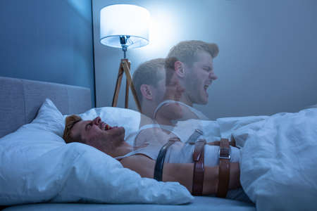 Man Suffering From Sleep Paralysis At Homeの写真素材