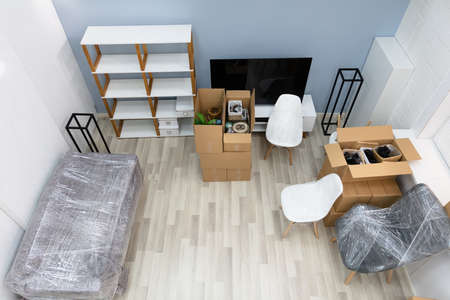 Living Room Interior Of New House With Moving Boxesの写真素材