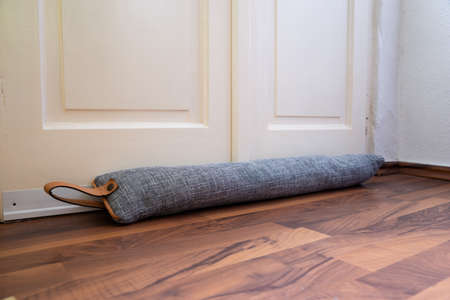 Draft Excluder Under Door Blocking Cold Air From Traveling Aroundの写真素材