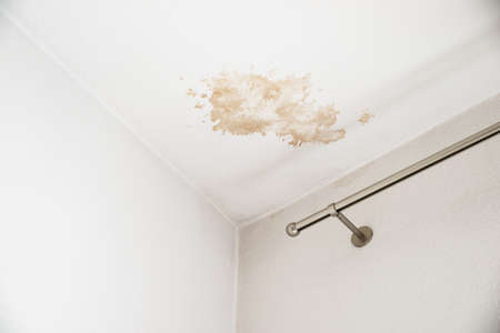 Ceiling Damaged By Water Leak At Homeの写真素材