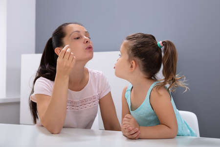 An Attractive Female Speech Therapist Helps The Girl How To Pronounce The Sounds In Office