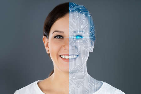 Close-up Of Two Faces Showing Woman And Robot Against Grey Background