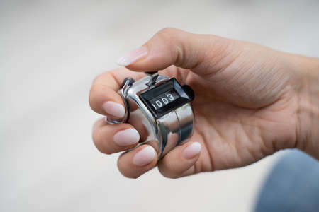 Close-up Photo Of Young Woman Using Headcounterの写真素材