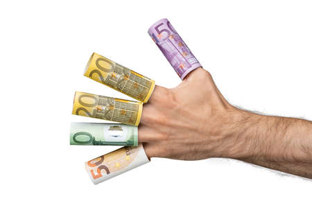 Close-up Of A Man's Hand Showing Rolled Up Euro Banknotes Over His Fingers