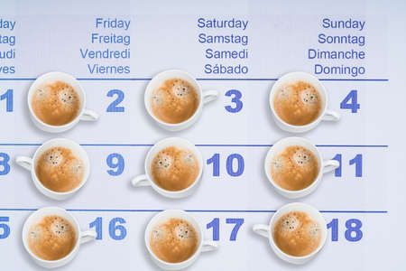 Coffee Cups Placed On Each Date In Calendarの写真素材