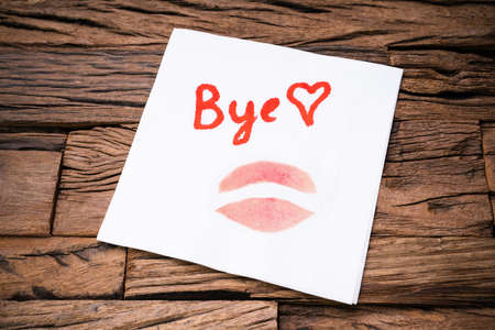 Handwritten Bye Word And Lipstick Mark On Napkinの写真素材