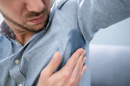Man With Hyperhidrosis Sweating Very Badly Under Armpit