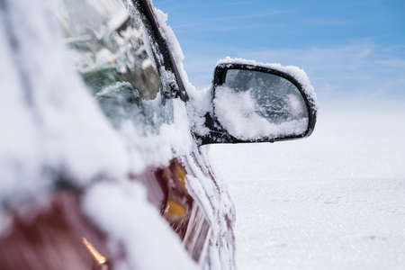 Car Mirror Covered With Snow After Snowfall