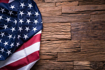 An Overhead View Of American Flag On Wooden Backgroundの写真素材