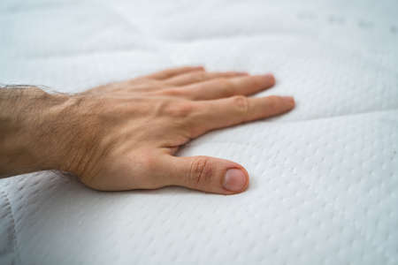 Hand Testing Orthopedic Memory Foam Core Mattressの写真素材