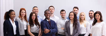 Group Of Young Successful Multi-ethnic Young Office Workers Standing Looking At Cameraの写真素材