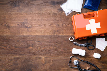 First Aid Kit With Medical Equipment On Wooden Backgroundの写真素材