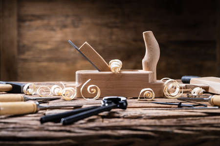 Various Carpenter Tools From Toolkit Laying On Desk