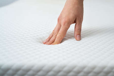 Hand Testing Orthopedic Memory Foam Core Mattressの写真素材