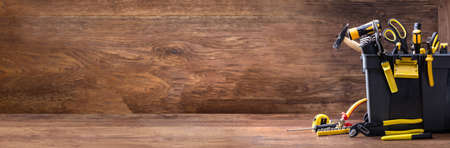 Toolbox With Various Worktools On Wooden Surfaceの写真素材