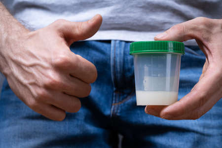 Sperm Donor Holding Container And Making Thumbs Up