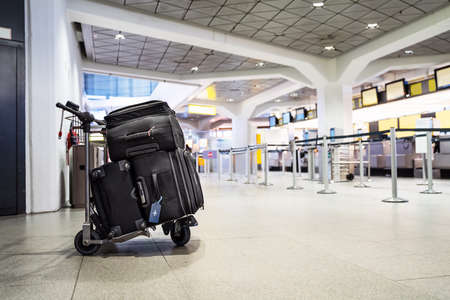 Baggage On Trolley Ready For Checkin In Airportの写真素材