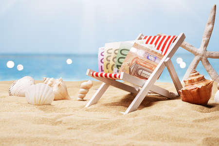 Euro Banknotes On Miniature Deck Chair At Beachの写真素材