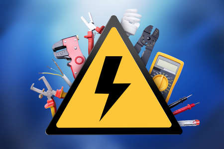 Various Electrician Tools Set Around High Voltage Sign On Blue Background