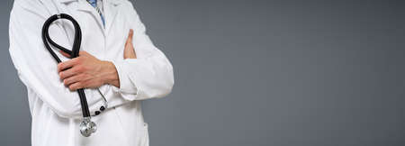 Panoramic View Of Male Doctor With Arms Crossed Holding Stethoscopeの写真素材