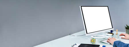 Close-up Of A Businessman Using Computer With Blank Screen At Workplace