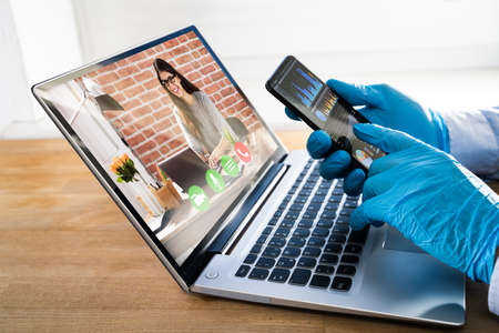 Man On Coronavirus Quarantine Using Video Conference To Work From Home