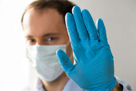 Man Making Coronavirus Pandemic Stop Hand Gesture