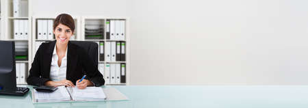 Accountant Woman In Office Doing Accounting And Finance Auditの写真素材