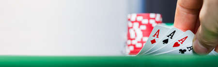Playing Poker Card Game At Night In Casino