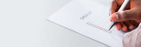 African American Hand Filling Form And Checklistの写真素材