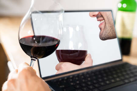 Virtual Wine Tasting By Friends Over Internet Using Video Conferenceの写真素材