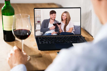 Virtual Wine Tasting By Friends Over Internet Using Video Conferenceの写真素材