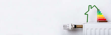Energy Radiator At Cold House. Reduce Heater Temperature,