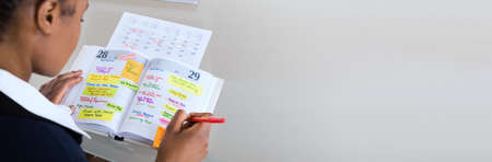 African People Planning Event In Calendar Schedule Planner の写真素材