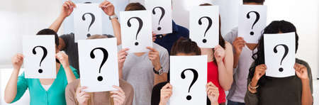 Confused Student Group Holding Question Marks Asking Questions