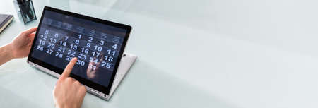 Calendar Planner At Convertible Laptop, Business Dateの写真素材