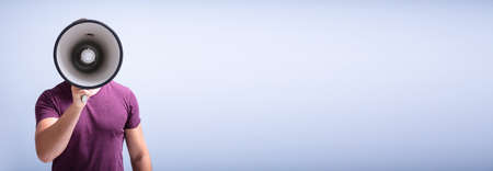 People Shout And Scream Through Megaphone For Attentionの写真素材