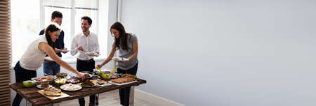 Friends At Brunch. People Eating Healthy Foodの写真素材