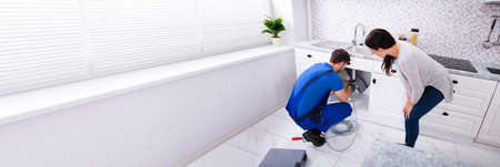 Plumber Cleaning Drain. Sewer Pipe Drainage In Houseの写真素材