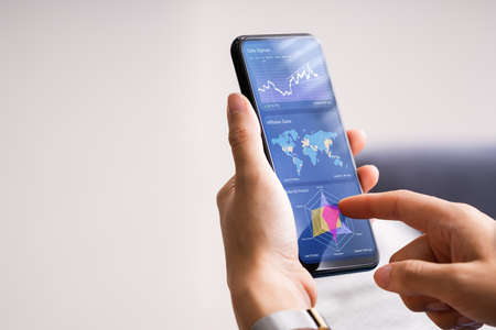 Smartphone With Marketing Analytics And KPI Dashboardの写真素材