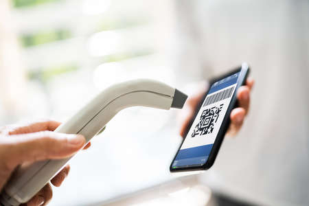 Using Mobile Phone To Scan Payment Code In Shop