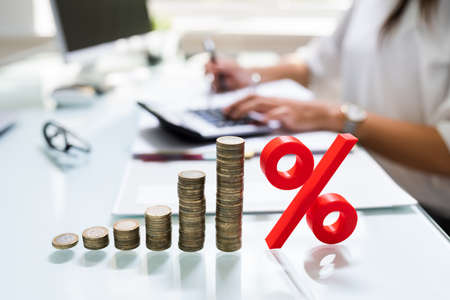Percentage Sign And Discount Rate. Accountant Signing Invoice