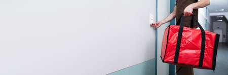 Food Delivery. Man With Pizza Bag Ringing Door Bell