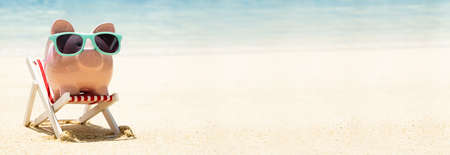 Piggy Bank On Vacation At Beach. Travel Loanの写真素材