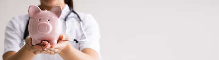 Piggy Bank Money Health Care By Medical Doctorの写真素材