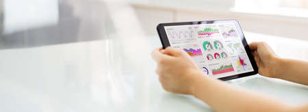 Marketing Business Advisor Using Tablet Computer At Deskの写真素材