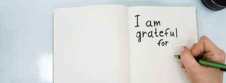 Gratitude Journal Concept. Writing I Am Grateful In Journalの写真素材