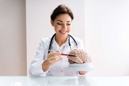 Brain Surgeon Or Neurologist Doctor Explaining To Patient