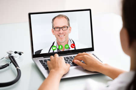 Medical Doctor Holding Online Elearning Video Conferenceの写真素材