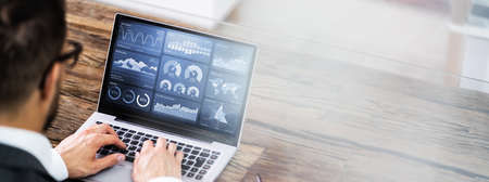 Businessman Using KPI Analytics Technology And Stock Exchange Dataの写真素材